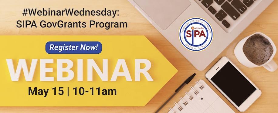 Laptop, mobile phone, spiral notebook, pen and coffe on a desk with text reading Webinar Wednesday SIPA GovGrants Program Register Now May 15 from 10 to 11 am
