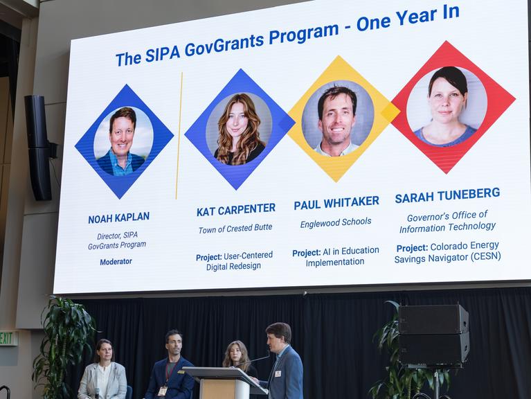 A photo of the SIPA GovGrants panel below a slide showing the panelists' headshots
