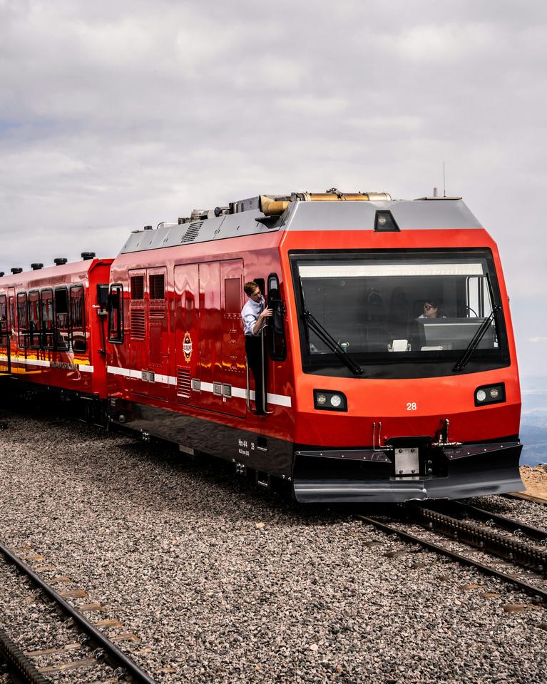 A photo of a red Pikes Peak Cog Railway train